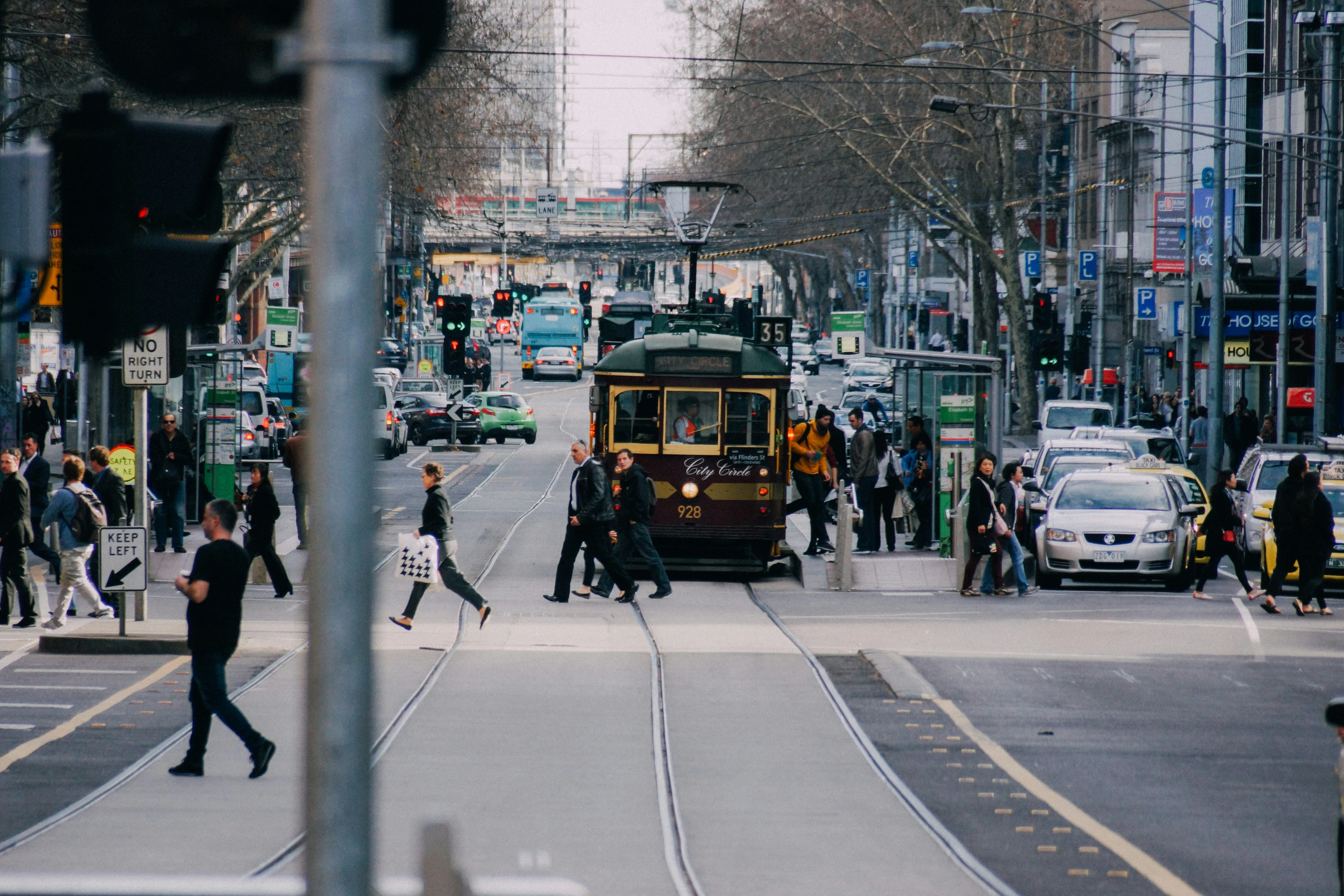 image of city transportation like card and tram and pedestrians