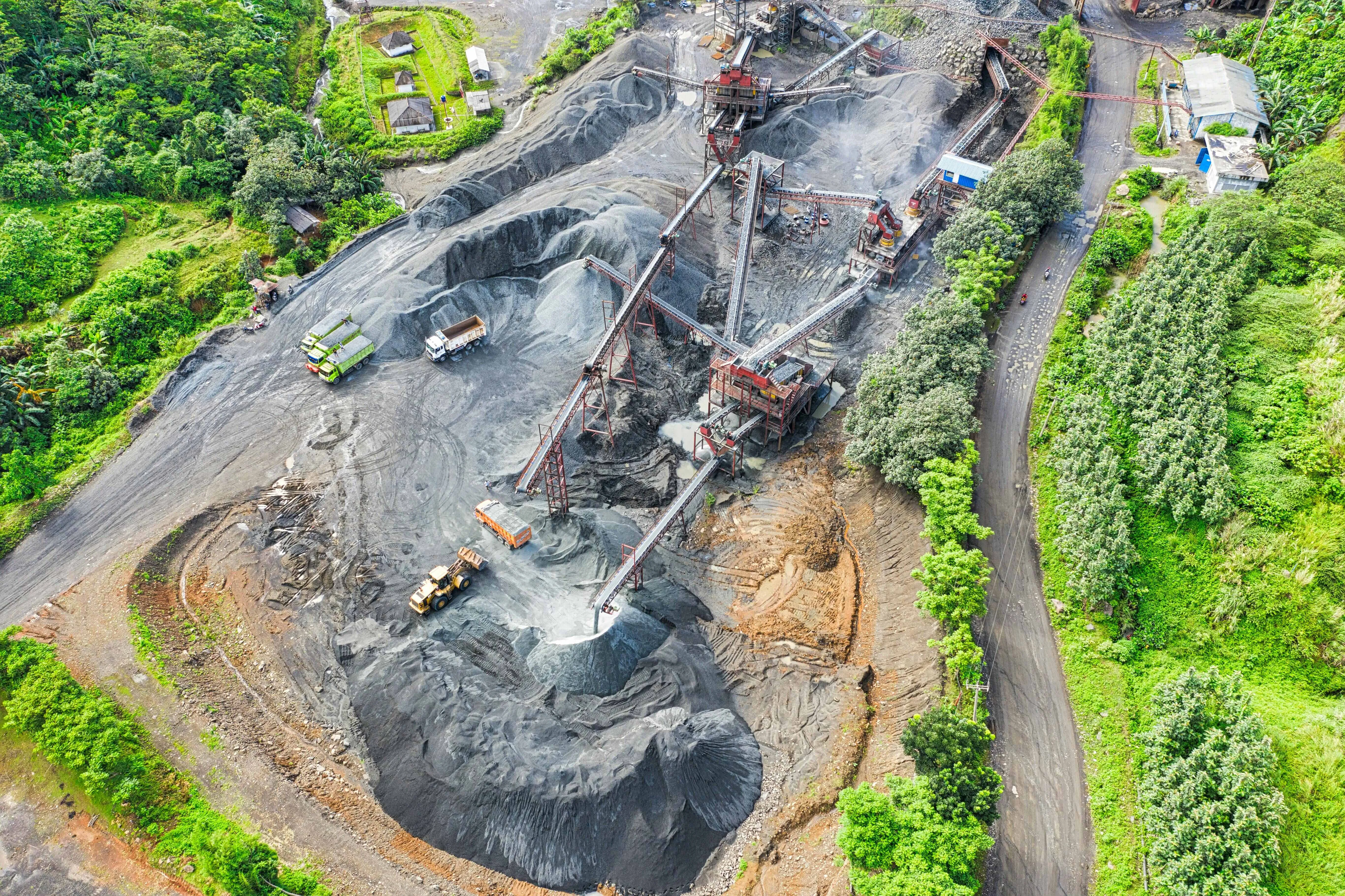 image of mining landscape with greeneries surrounding the mine