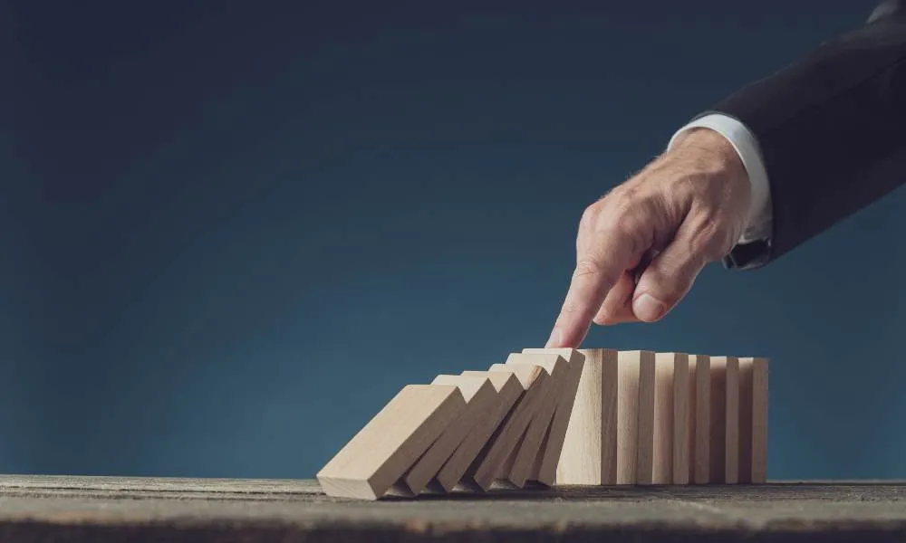 image of a hand with domino blocks symbolizing stakeholder engagement