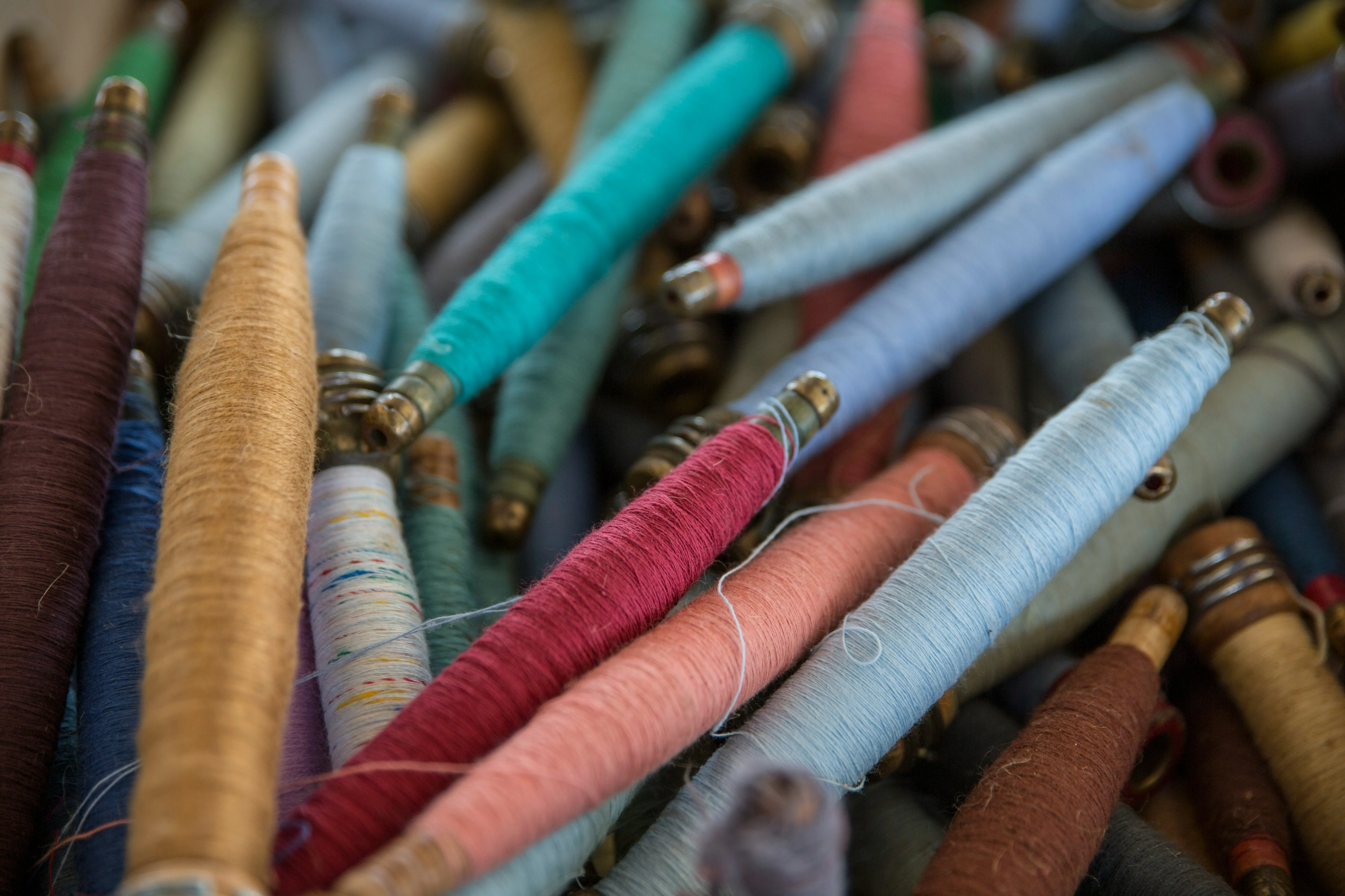 image of different colored textile threads and fabric