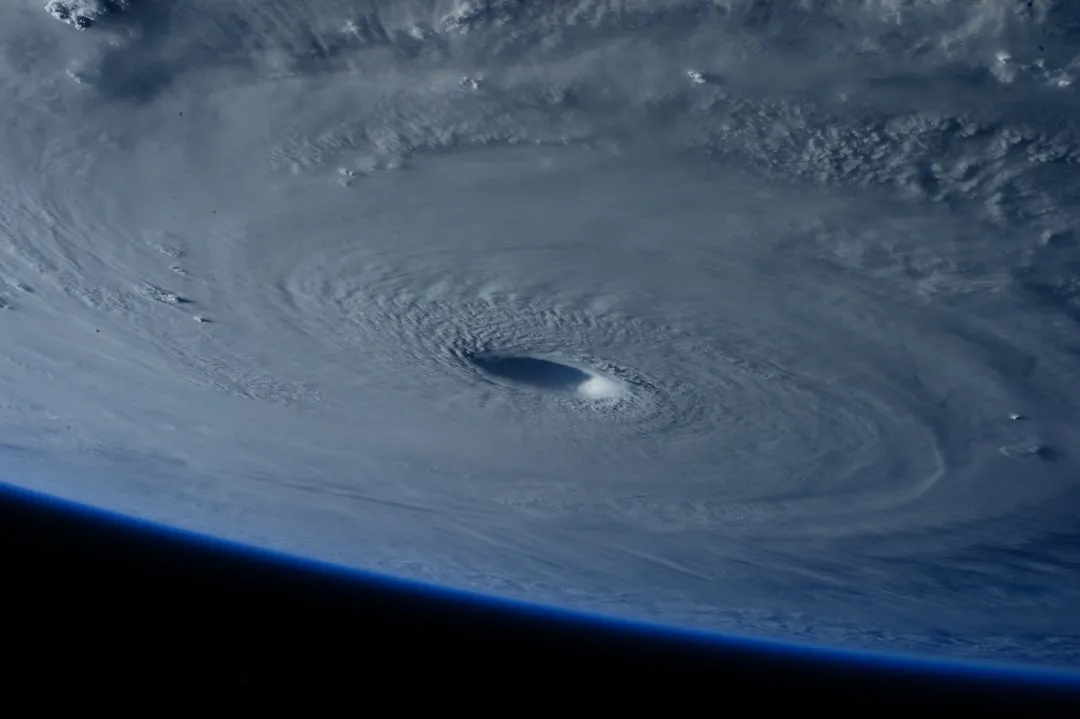 hurricane seen from outerspace, article about hurricane milton and climate change